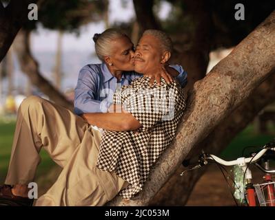 Woman kissing man Stock Photo