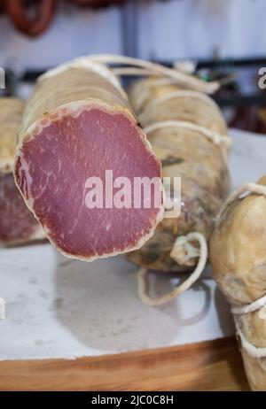 Iberian cured loin  displayed at street market stall. Closeup Stock Photo