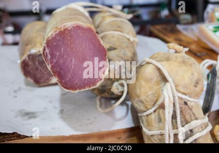 Iberian cured loin  displayed at street market stall. Closeup Stock Photo