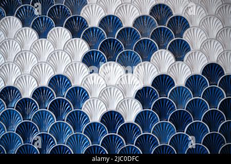 background of ceramic tiles in shell shape in blue and white Stock Photo
