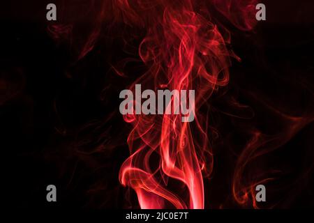 Abstract red color smoke pattern isolated on black background Stock Photo