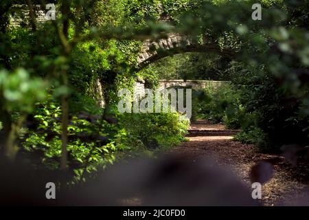 Arched bridge over track at The Garden Station, Restored Victorian railway station, Langley-on-Tyne, Northumberland Stock Photo