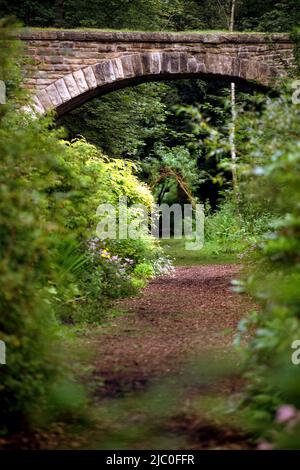 Arched bridge over track at The Garden Station, Restored Victorian railway station, Langley-on-Tyne, Northumberland Stock Photo