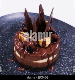 dark and white chocolate cake with cherries and hazelnut Stock Photo