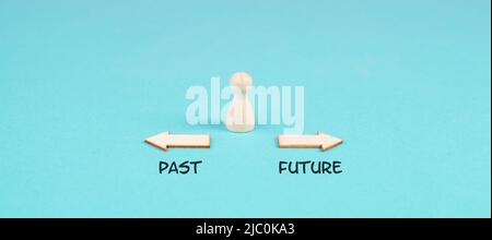 Arrows show to different directions, past and future, progress and development, taking a new path, opportunity for a new beginning, making a decision Stock Photo