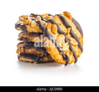 Chip cookies with peanuts and chocolate strips isolated on a white background. Stock Photo