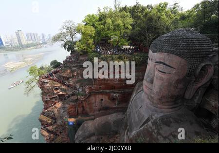 (220609) -- CHENGDU, June 9, 2022 (Xinhua) -- Photo taken on April 1, 2019 shows the Leshan Giant Buddha in southwest China's Sichuan Province. Mount Emei, located in southwest China's Sichuan Province, is an area of striking scenic beauty, notable for its lofty mountain and lush vegetation. It is also of great spiritual and cultural significance, in which there are archaeological sites, important architecture, tombs, ritual spaces, and collections of cultural artefacts, including sculpture, stone inscriptions, calligraphy, and paintings, among other traditional arts. Mount Emei is known as o Stock Photo