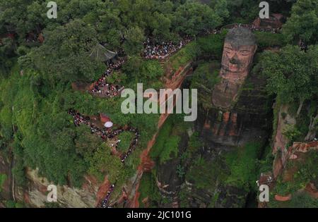 (220609) -- CHENGDU, June 9, 2022 (Xinhua) -- Aerial photo taken on Oct. 4, 2018 shows the Leshan Giant Buddha in southwest China's Sichuan Province. Mount Emei, located in southwest China's Sichuan Province, is an area of striking scenic beauty, notable for its lofty mountain and lush vegetation. It is also of great spiritual and cultural significance, in which there are archaeological sites, important architecture, tombs, ritual spaces, and collections of cultural artefacts, including sculpture, stone inscriptions, calligraphy, and paintings, among other traditional arts. Mount Emei is know Stock Photo