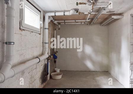 Empty boiler room after water damage and drying in the basement Stock Photo