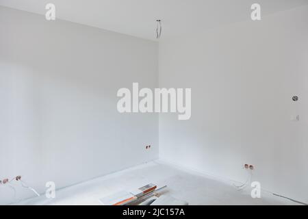 White corner and ceiling in the room after painting work during house construction Stock Photo