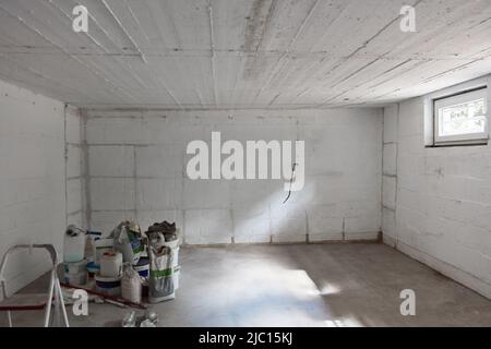 Empty large room in basement of family house before renovation Stock Photo