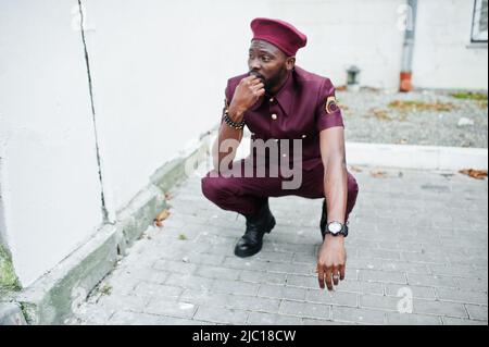 Portrait of African American military man in red uniform and beret. Stock Photo
