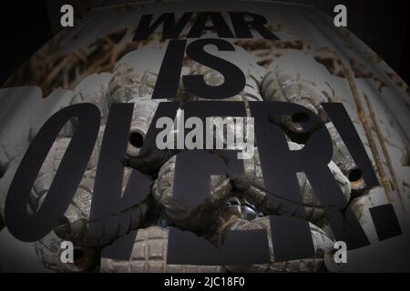 War is over writing black on bomb background Stock Photo