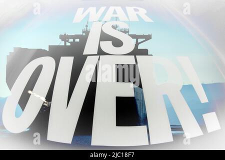 War is over writing white on ship background Stock Photo