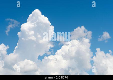 Nimbostratus clouds gather on a blue sky Stock Photo