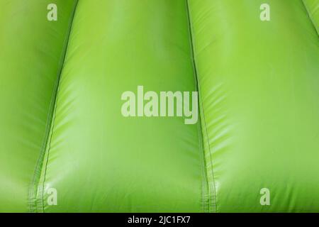 Inflatable design. Trampoline for jumping. Green material. Air three designs. Children's area. Obstacle bar is in details. Stock Photo