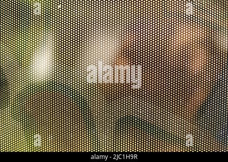 Mesh texture on glass. Shooting window. Small cage. Textured surface. Stock Photo