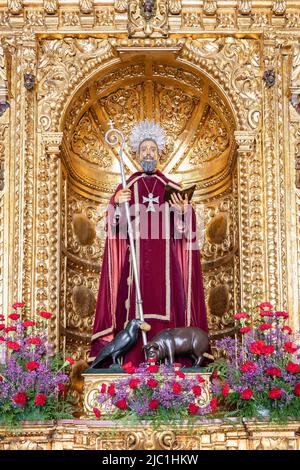 Trigueros, Huelva, Spain - April 17, 2022: Sculpture of San Antonio Abad (Saint Anthony Abbot),saint of trigueros, in its golden chapel Stock Photo