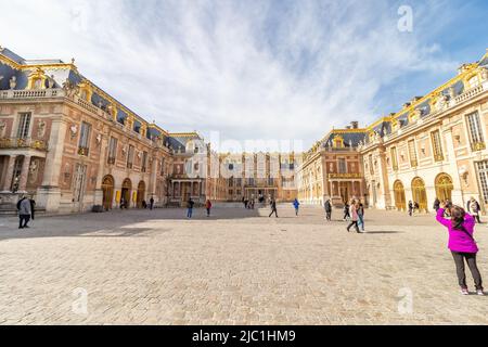 Paris, France - March 17, 2018: Tourists visiting the Palace of Versailles in a sunny day Stock Photo