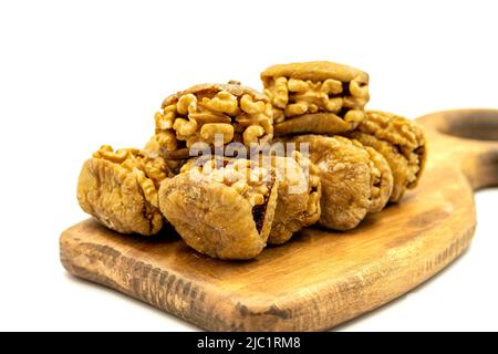 Stuffed dried figs. Dried figs stuffed with walnuts isolated on white background. Close-up. local name cevizli incir Stock Photo