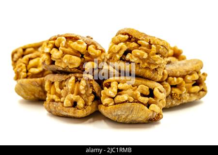 Stuffed dried figs. Dried figs stuffed with walnuts isolated on white background. Close-up. local name cevizli incir Stock Photo