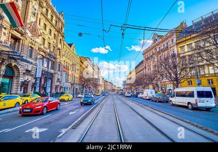BUDAPEST, HUNGARY - FEBRUARY 23, 2022: The heavy traffic on Grand Boulevard, one of the most busiest streets in Pest side, on February 23 in Budapest, Stock Photo