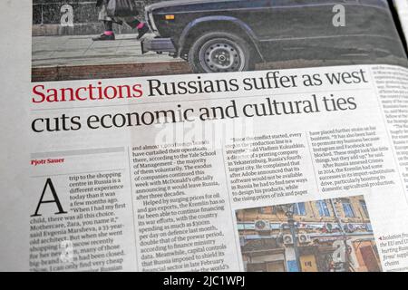 'Sanctions:  Russians suffer as west cuts economic and cultural ties' Guardian newspaper headline article 20 May 2022 London UK Stock Photo