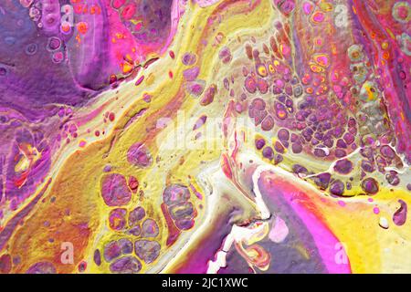 Spread-out acrylic paint Abstract background made in the technique of fluid art Fashionable colorful background in warm colors Stock Photo