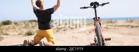 Male cyclist riding rejoicing of win competition Stock Photo