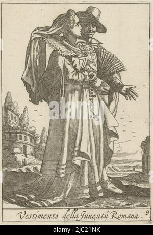 Landscape showing a young couple dressed in fashion from Rome, Italy. The couple is shown full-length, the woman en profile. The man stands somewhat hidden behind the woman, leaving only the hat-trimmed head visible. The woman is dressed in a long gown with open sleeves, in her hands she holds a fan and a rosary. The print is part of a twelve-part series of prints depicting Italian costumes, Young couple dressed according to Roman fashion Vestimento della Juvent Romana (title on object) Costumes from Italy (series title), Pieter Lastman, print maker: anonymous, publisher: Covens & Mortier Stock Photo