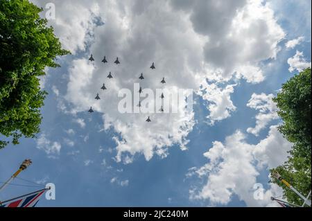 The Mall, London, UK. 2 June 2022. Large crowds on The Mall after 2022 Trooping the Colour watch the large RAF flypast, including 15 Typhoons in 70 formation. Credit: Malcolm Park/Alamy Live News Stock Photo