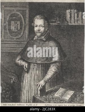 Portrait to the left of Jacobus a Castro, third bishop of Roermond. He is standing between a table and a chair in a study. His left hand rests on a closed book. On the table is an open book. Behind on the left a coat of arms on the wall, crowned with a cardinal's hat. Behind on the right some books on a shelf. Above the image a three-line Latin text with the name of the person portrayed, his function, year of death and age. Below the image a six-line Latin text and a two-line dedication in Latin to the subject's cousins, Portrait of Jacobus a Castro, print maker: Abraham Dircksz. Santvoort Stock Photo