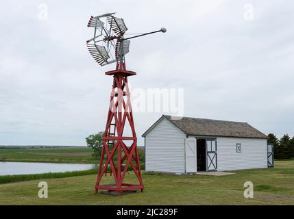 A windmill and granary building at the Welk Homestead State Historic Site in North Dakota, the boyhood home of Lawrence Welk. Stock Photo