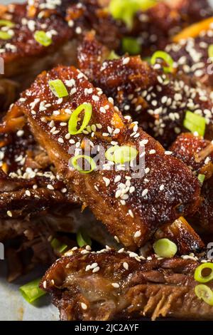 Homemade Spicy Asian Baby Back Ribs with Sesame and Green Onions Stock Photo