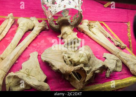 Various human bones, not clearly labelled as Saint Lucy's, (which the cathedral is reported to house) but relics on display in The  Chapel of The Crucifix, Santa Lucia Cathedral in Syracuse Cathedral, Sicily. Italy. (129) Stock Photo