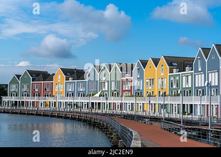 Houten, Netherlands - 9 June, 2022: view of the colorful rainbow houses and lake in Houten Stock Photo