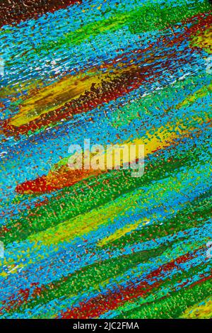 Creative background of colorful brush strokes on canvas closeup. Abstract art background from smeared brush strokes of green red blue yellow colors macro. Drawing painting paint texture backdrop Stock Photo
