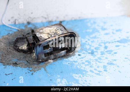 Toaster after fire. Household electrical appliance fire hazard. Overload. Short circuit. Carelessness. Safety in home. Danger home inflammation Insura Stock Photo