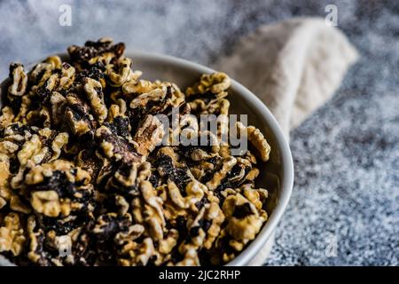 Close-up of a bowl of raw organic walnuts Stock Photo