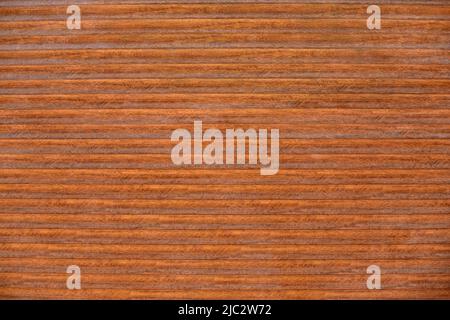 Background of brown horizontal metal strips. Roller blinds and garage gates. Closed metal shutter casements. Texture of wooden blind with horizontal l Stock Photo