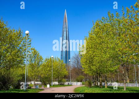 SAINT PETERSBURG, RUSSIA - MAY 22, 2022: Alley in the park leading to the modern building 'Lakhta Center'. Saint-Petersburg Stock Photo