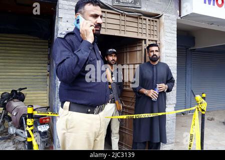 View of venue while security officials are cordon off the site for investigation is underway after death of Tehreek-e-Insaf (PTI) MNA and TV personality Dr. Amir Liaquat Hussain at his home located on Khudadad Colony in Karachi on Thursday, June 09, 2022. PTI MNA and TV personality Dr. Amir Liaquat Hussain passed away in Karachi on Thursday, Geo News reported, quoting his servant Javed and hospital officials. He was 50. The PTI leader was found unconscious at his home and shifted to a private hospital in a critical condition where he was declared dead. Stock Photo