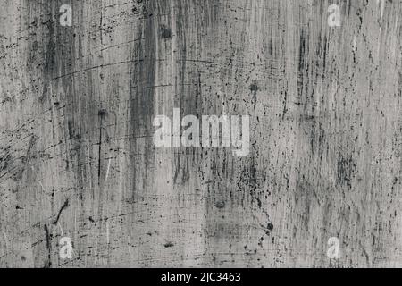 Grunge abstract beautiful monochrome black and gray wall with cracks and splashed black paint on plaster. Background with space for text or image. The art of rough stylized texture. Stock Photo