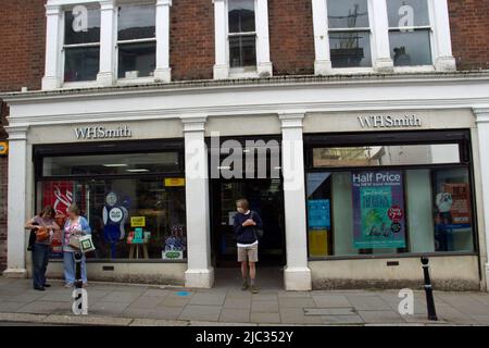 TOTNES, UK - JUNE 26, 2021 branch of WH Smith stationers on  Fore Street on a cloudy day Stock Photo