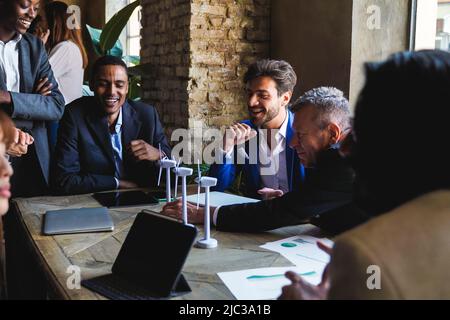 Multiethnic business people working on sustainable renewable energy project inside office - Green alternative electricity concept Stock Photo