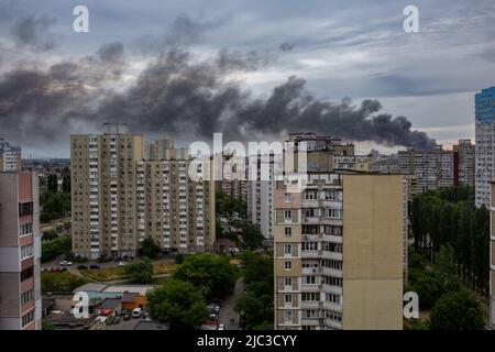 KYIV, UKRAINE - JUN 05, 2022: Kyiv rocked by blasts from Russian cruise missiles. Smoke rises over residents houses after missile strikes, as Russia's Stock Photo
