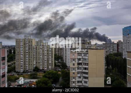 KYIV, UKRAINE - JUN 05, 2022: Kyiv rocked by blasts from Russian cruise missiles. Smoke rises over residents houses after missile strikes, as Russia's Stock Photo