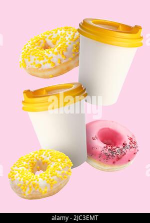 Flying cups of coffee and doughnuts on pink background Stock Photo