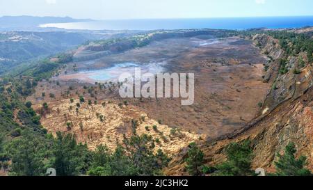 Ecosystem restoration. Aerial panorama of backfilled open pit Limni copper mine near Polis, Cyprus Stock Photo