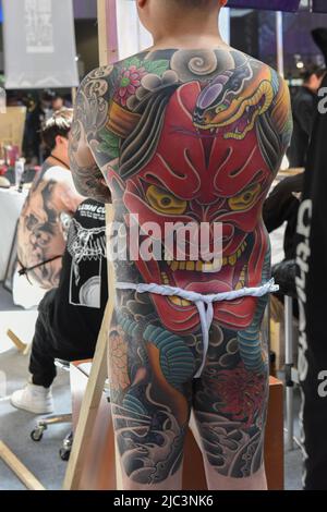 An asian woman with a full body body tattoo, in a japanese style at the  12th London Tattoo Convention 2016, Tobacco Dock, 50 Porters Walk, London,  UK Stock Photo - Alamy